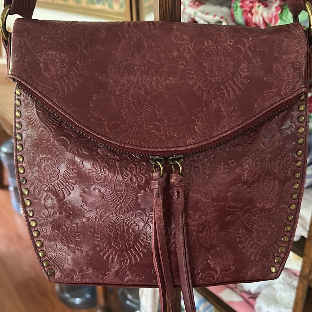 The Sak Burgandy Crossbody Bag with Embossed Floral Design